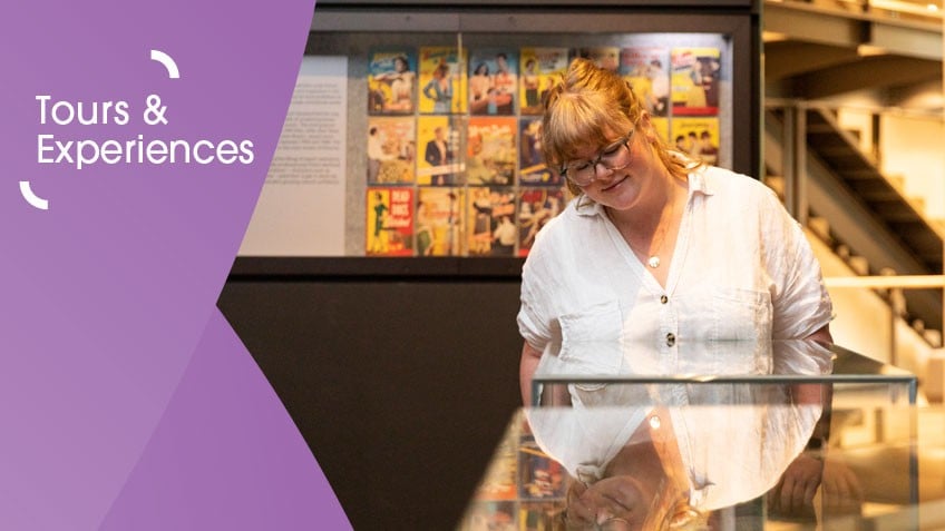 Woman in white shirt looking at display case